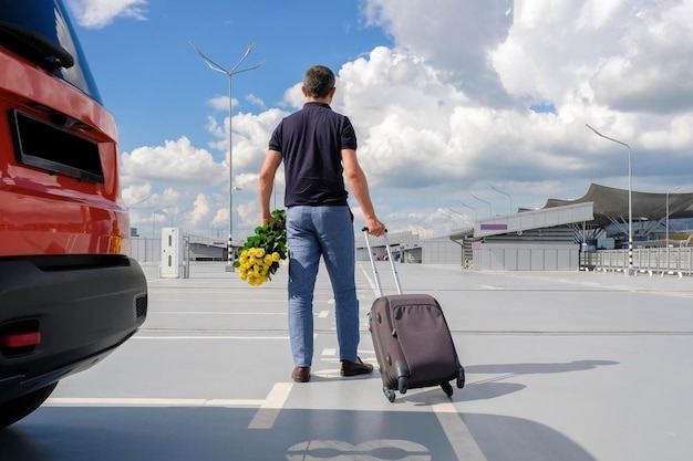 man-with-luggage-airport-parking