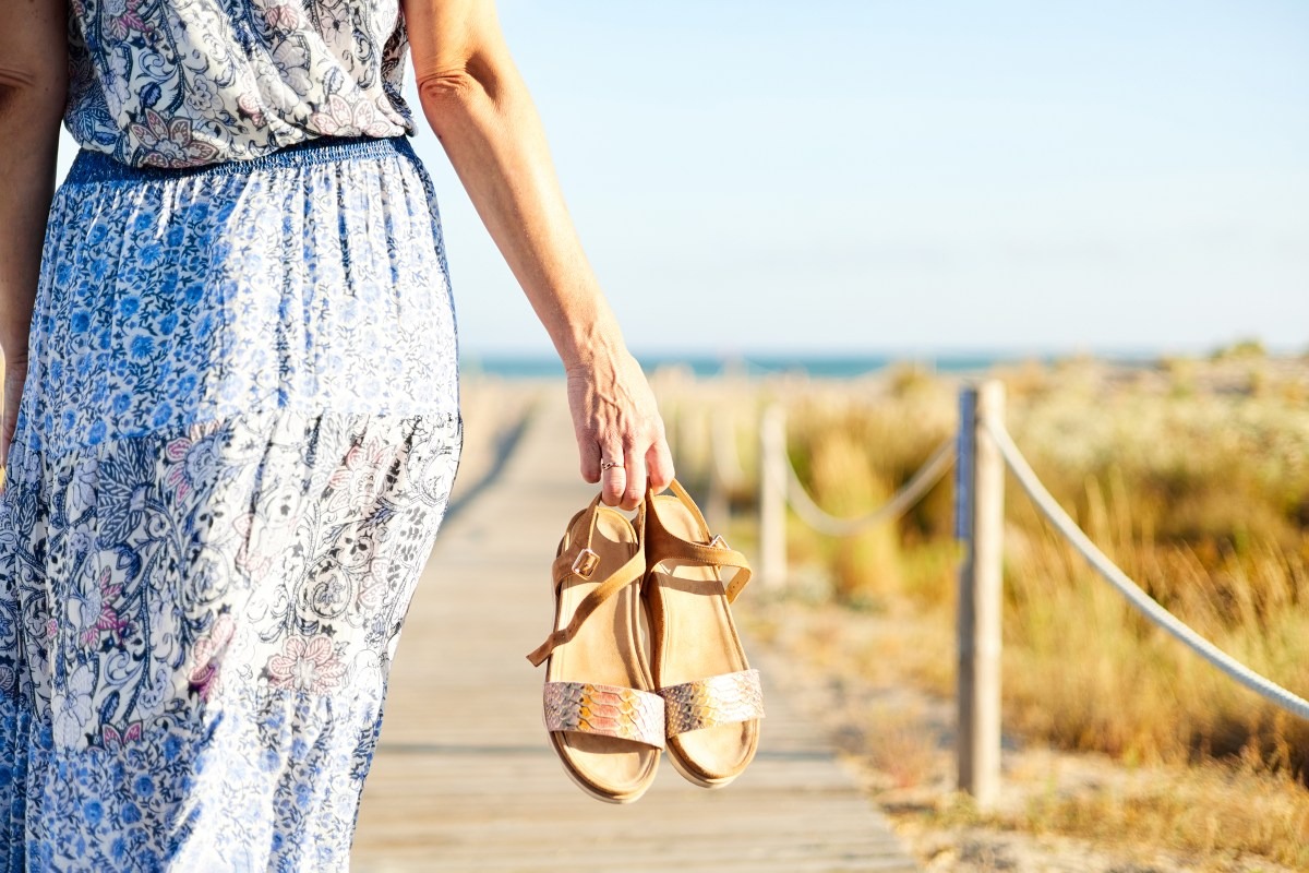 unrecognizable-woman-walking-to