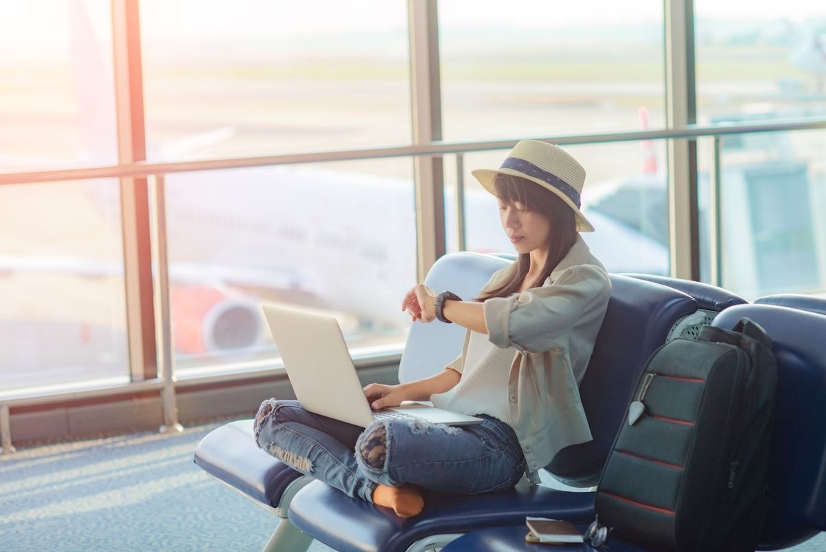 woman-checking-her-watch-at-airp